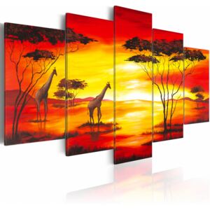 Konst Giraffer på bakgrunden med solnedgång